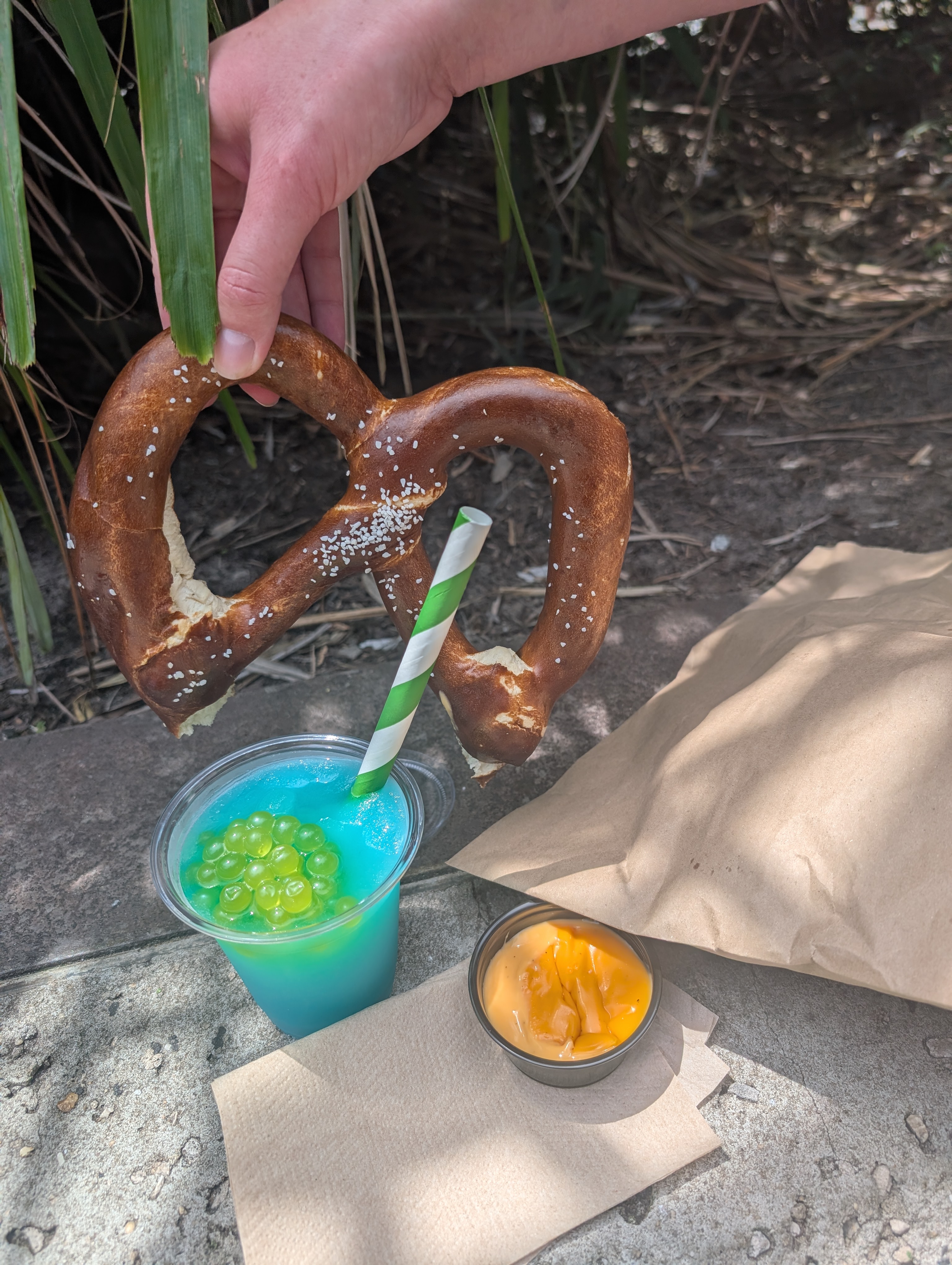 Giant pretzel and margarita cocktail with boba
